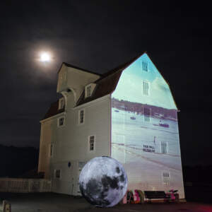 The Mill in moonlight with inflatable Moon in foreground